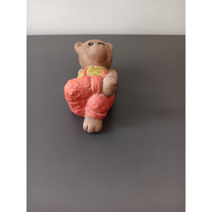 Vintage spaarpot beer liggend