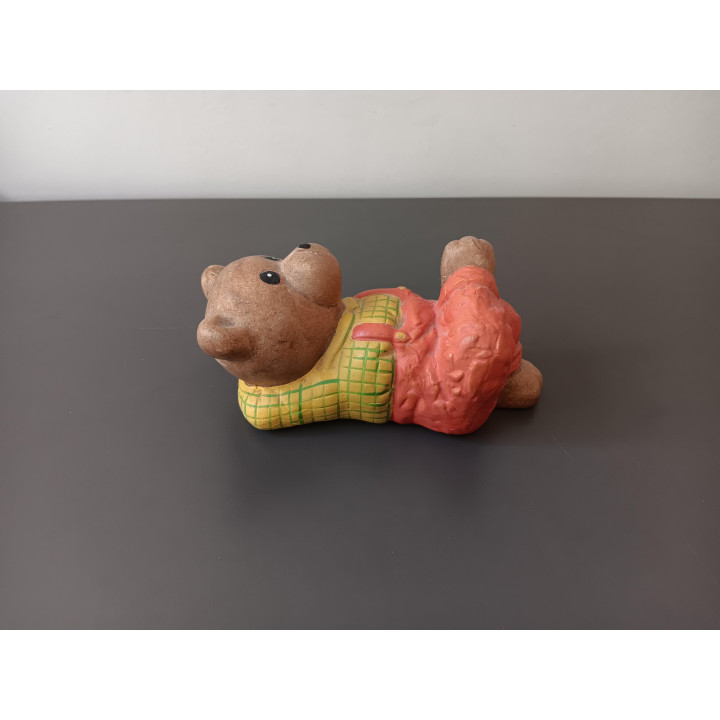 Vintage spaarpot beer liggend