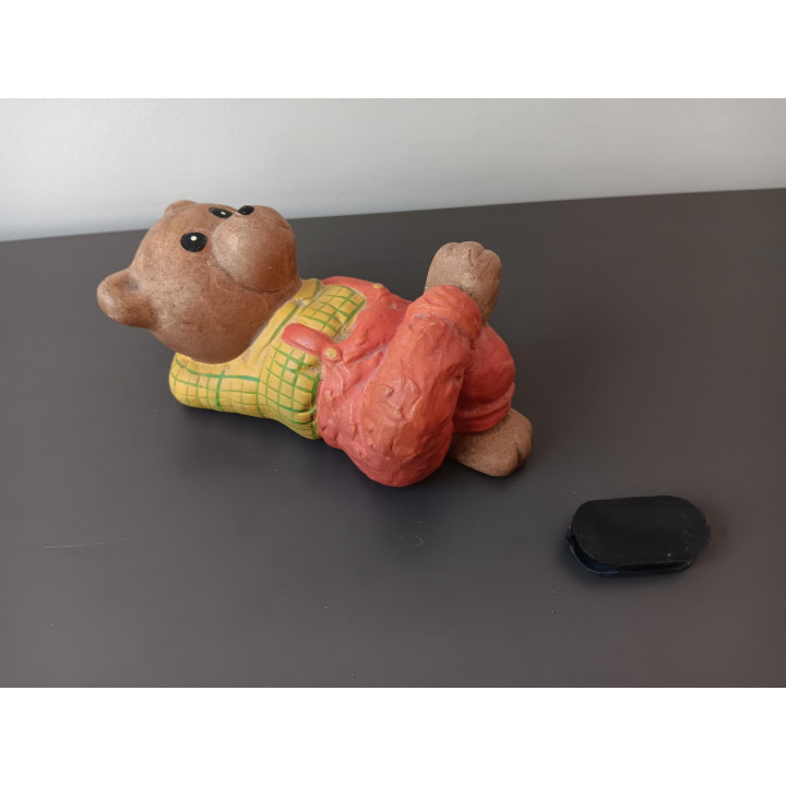 Vintage spaarpot beer liggend