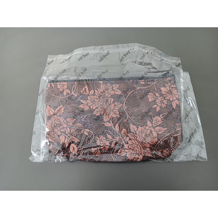 Make-uptasje koperkleur met bloemmotief