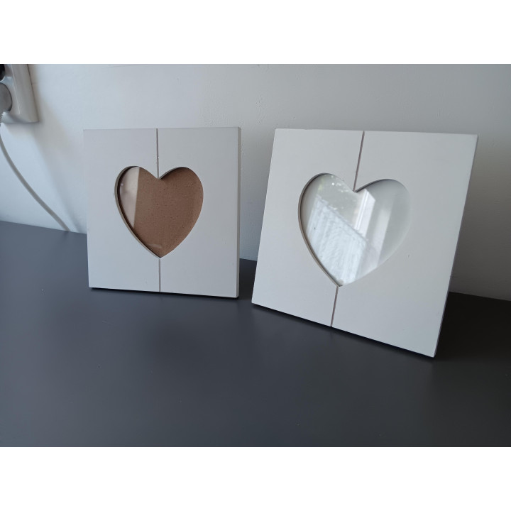 2 witte fotolijstjes hartvorm 16x16