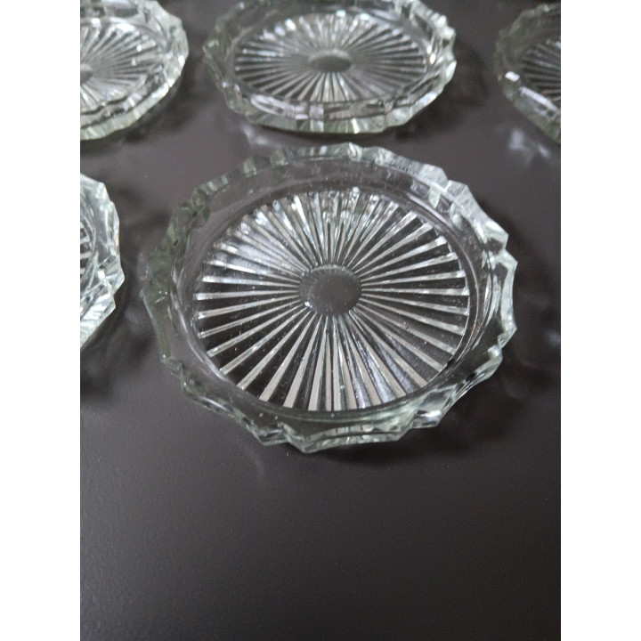 Set van 12 glazen onderzetters in originele doos