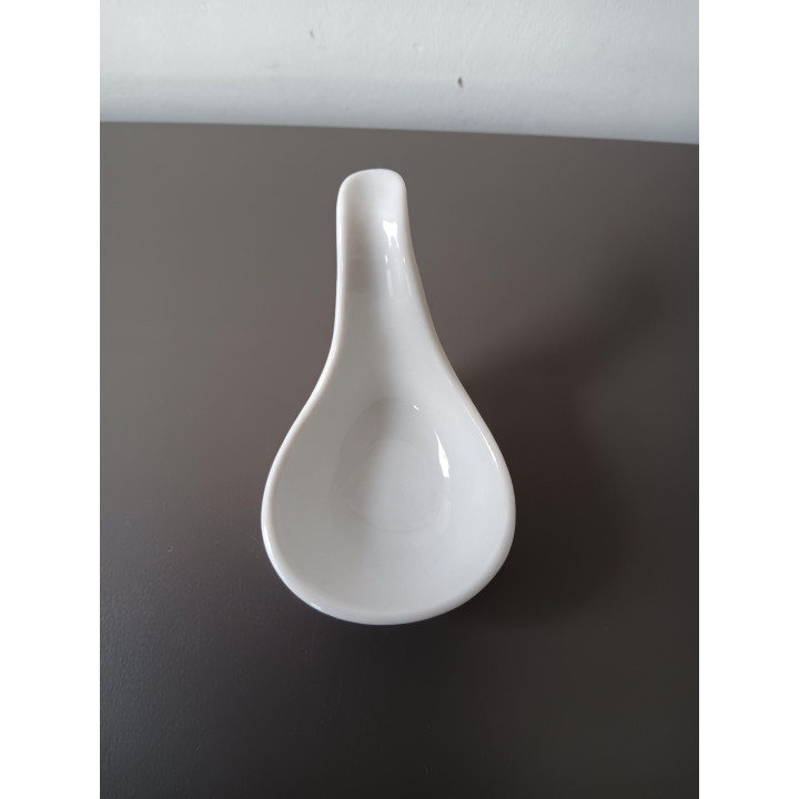 Witte keramische amuselepel