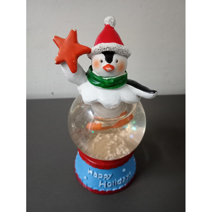 Kerst sneeuwbol met pinguïn en ster Happy Holidays