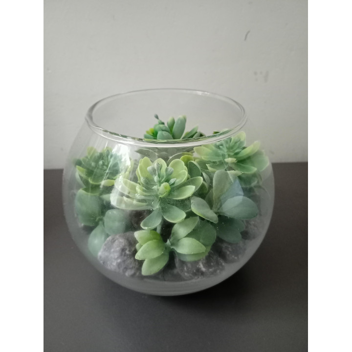 Glazen decoratievaasje met kunstvetplanten